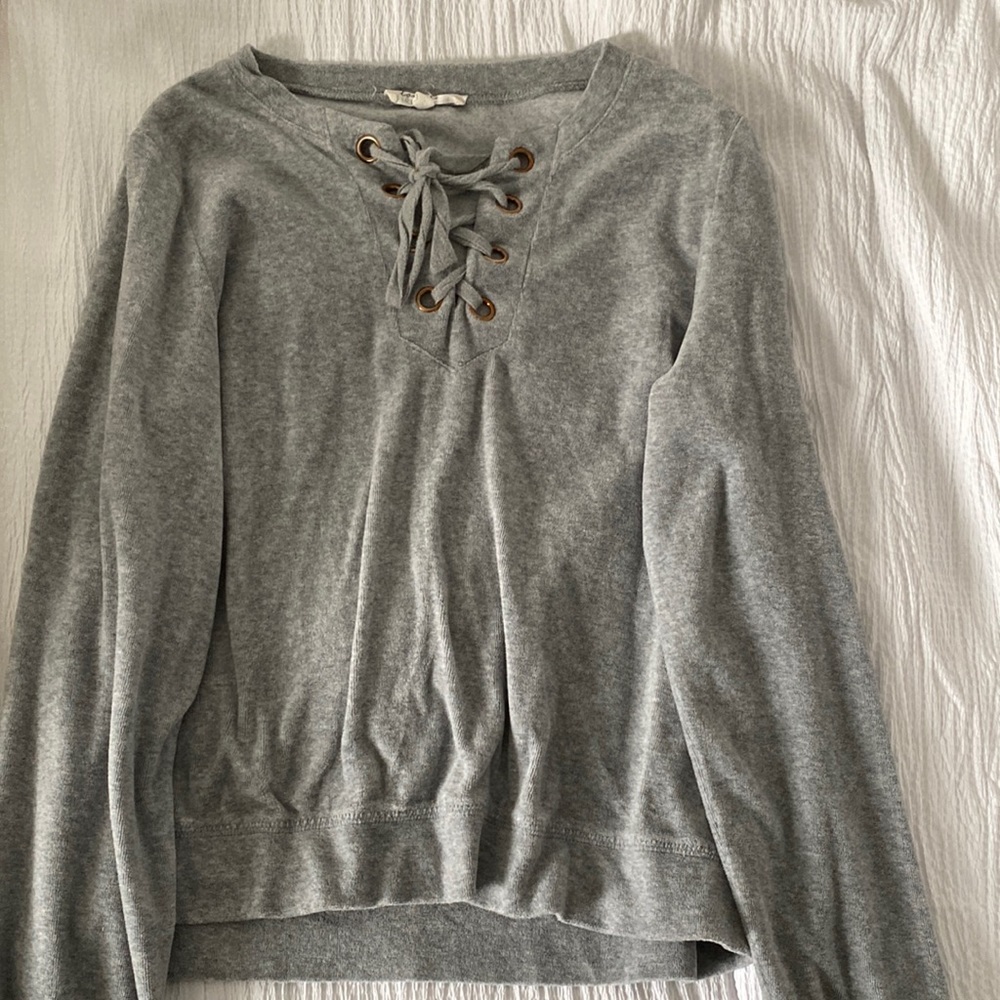 Grey crew neck sweater with front lacing